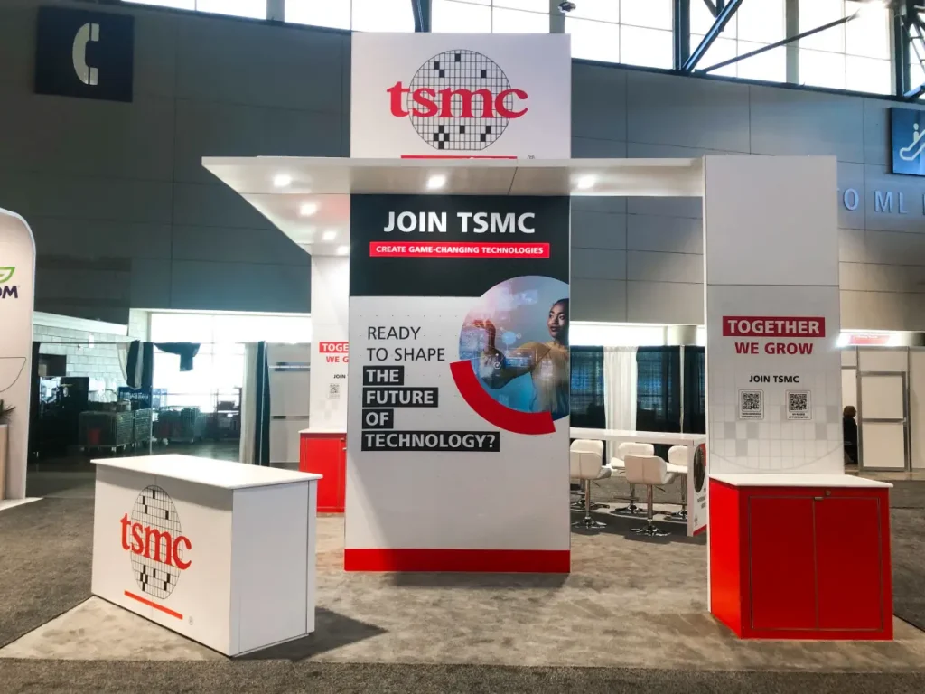 TSMC-branded exhibition booth with informational displays.