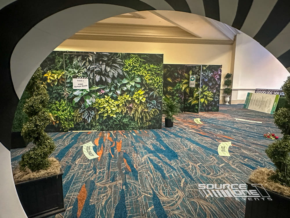 Spacious branded meeting room featuring large botanical wall murals, modern finishes, and flexible event space design.